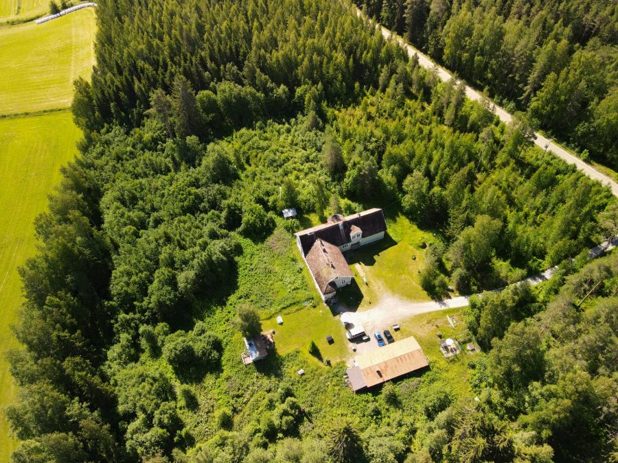 Top-down view of the main house, outbuildings and yard
