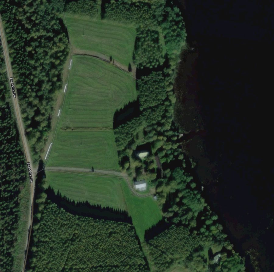 Aerial view of the game park site by the lakeshore at Sarkkilantie